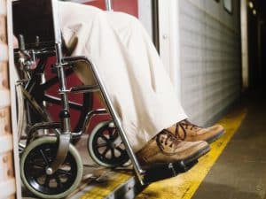 A person in a wheelchair faces transportation problems accessing a train due to a gap.