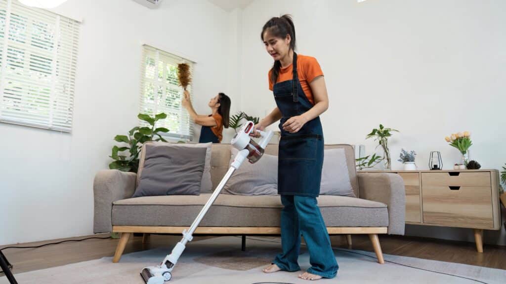 Support worker assisting with household cleaning tasks in a Sydney home